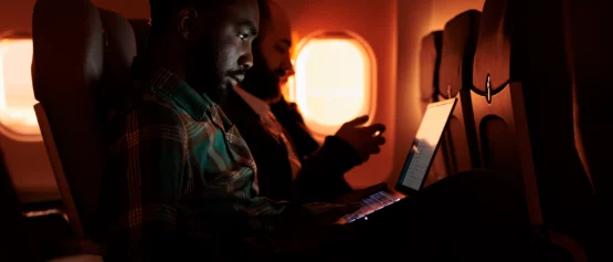 passenger on plane using inflight wi-fi by globalreach