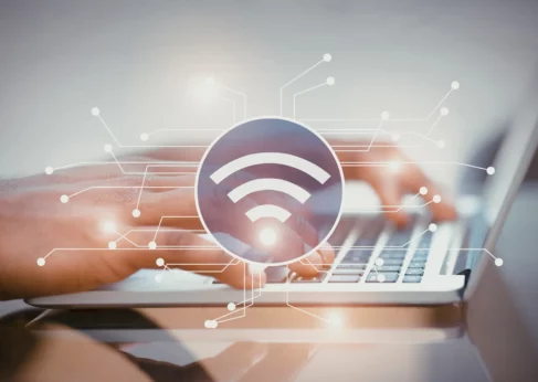 person using keyboard to view wireless-broadband-alliance-report