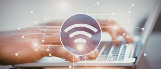 person using keyboard to view wireless-broadband-alliance-report